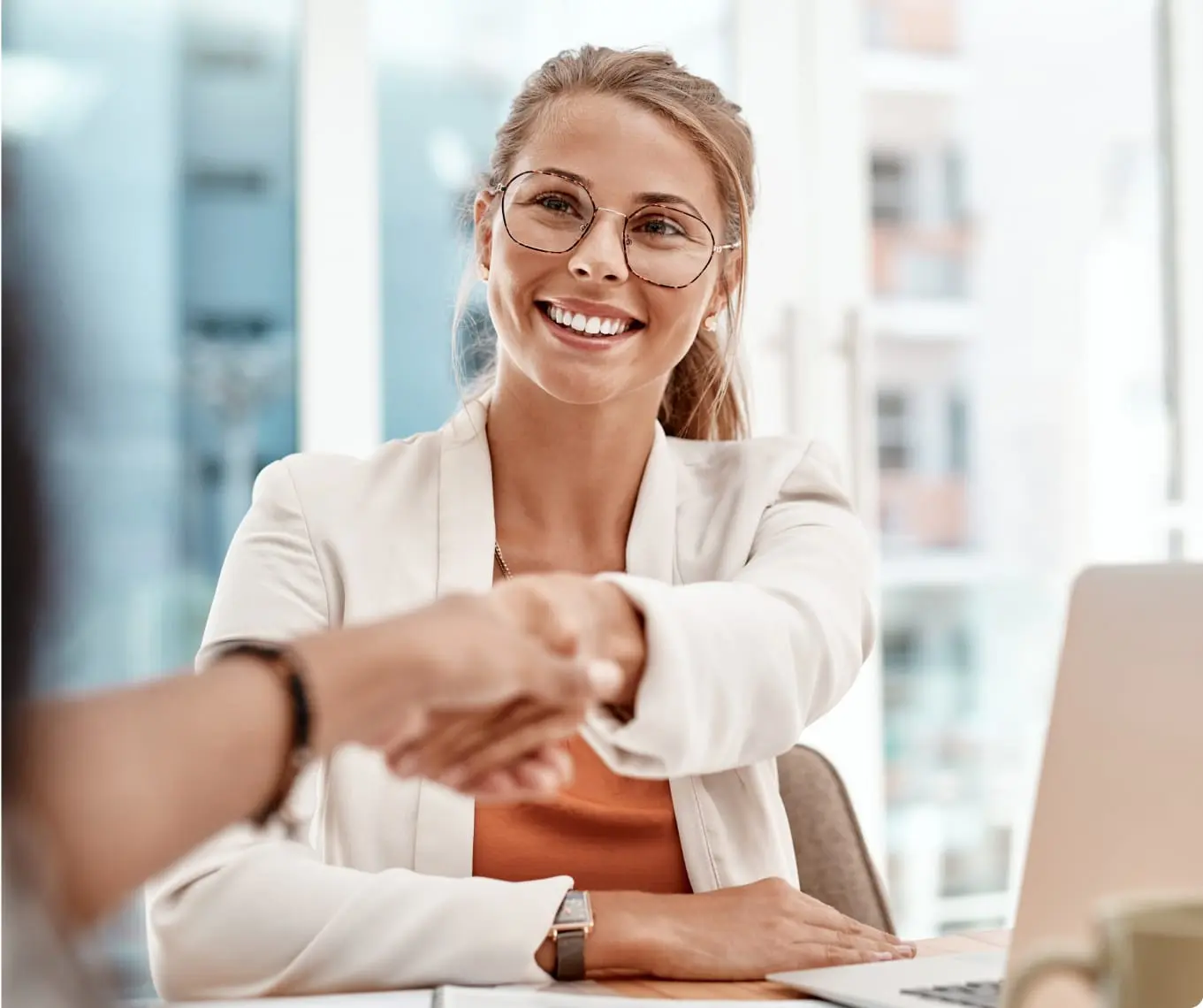 Business professional woman shaking hands