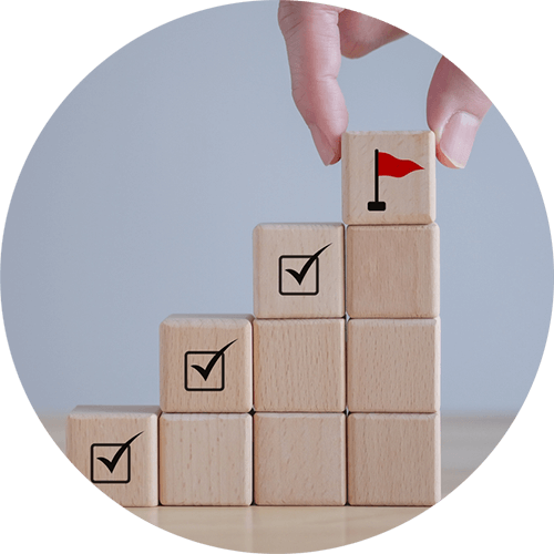 stack of wooden blocks with checkmarks