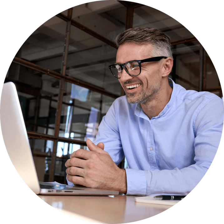 a man looking at a laptop